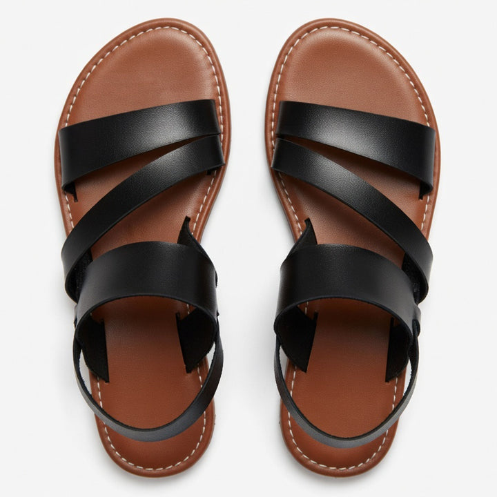 Women's summer flat sandals: comfortable open-toe design with stylish crossover straps for casual days.