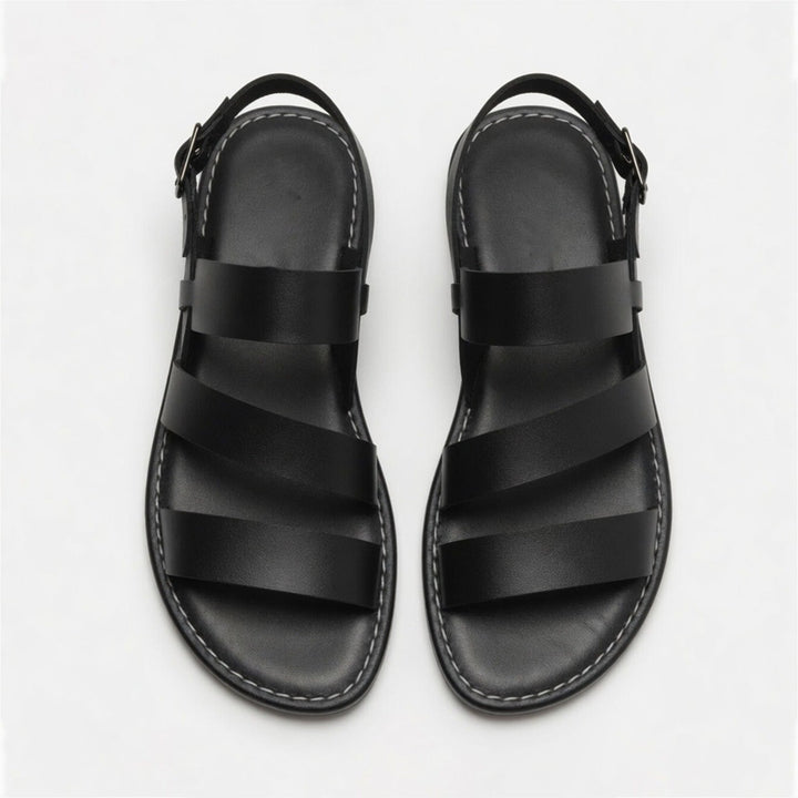 Lightweight women's flat sandals, open-toe & crossover strap design, essential for summer comfort.