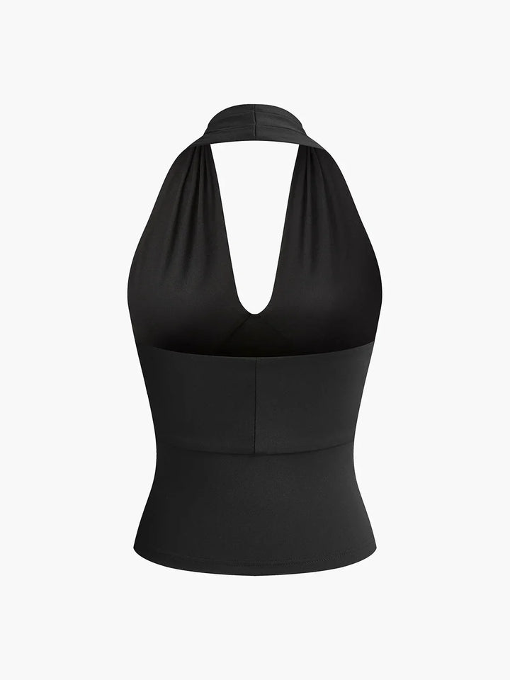 Elegant women's sleeveless halter top. Crossover V-neck design, perfect for spring and summer fashion. Slim fit.