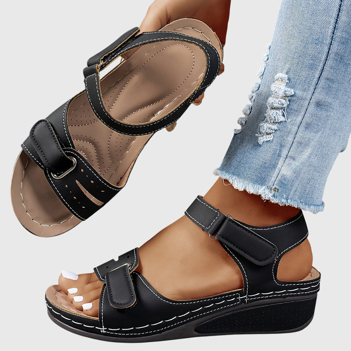 Supportive women's orthopedic sandals with crystal design, arch support & non-slip sole for foot pain relief.
