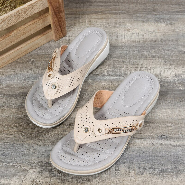 Stylish women's flip flops featuring a chic decorative strap & comfortable cushioning, perfect for beach or casual wear.