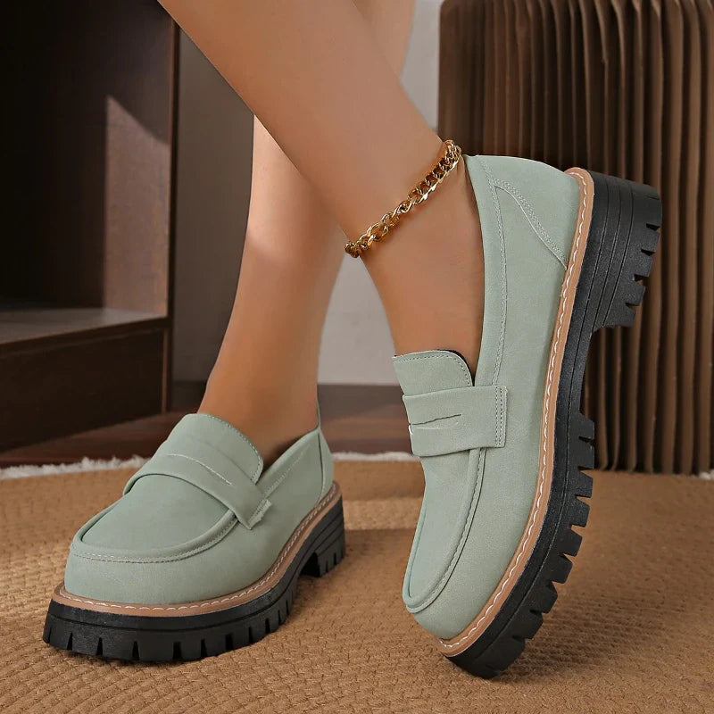 Comfortable women's platform loafers with cushioned orthopedic support & stylish slip-on design.