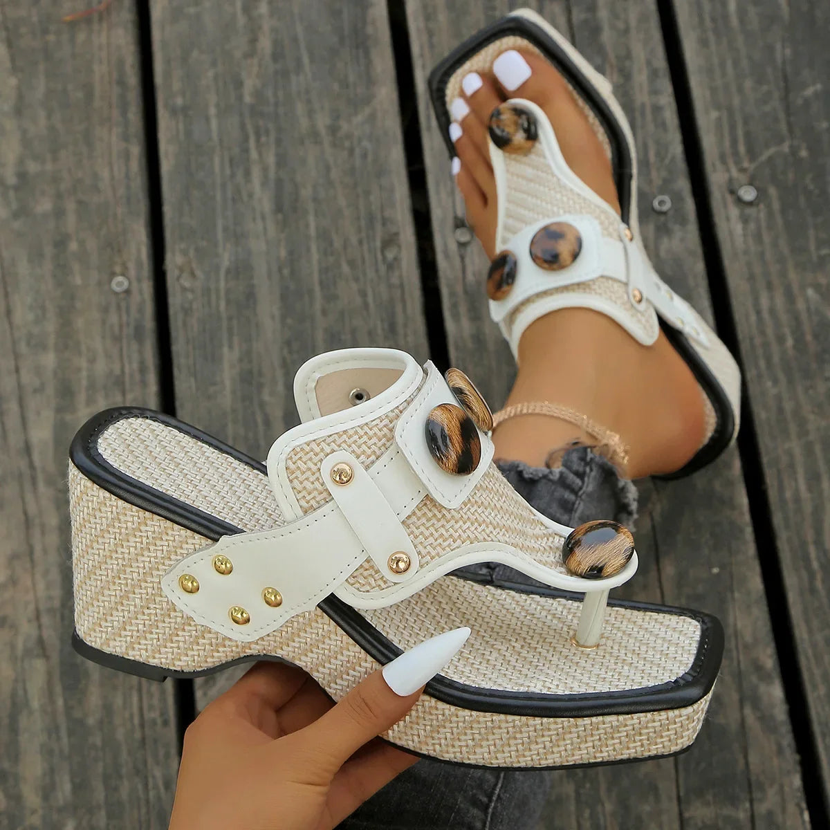 Contemporary women's studded platform slides, cushioned for support and sleek summer style.