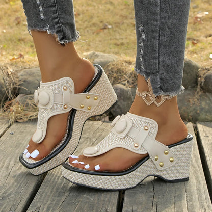 Stylish women's platform slides, featuring soft cushioning & eye-catching studded accents.