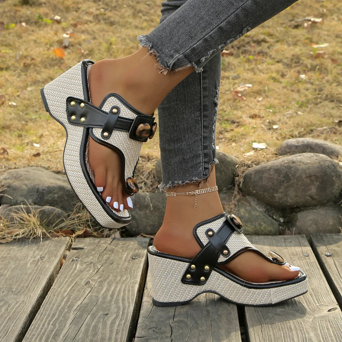 Fashionable women's platform slides, featuring plush cushioning & bold studded accents.