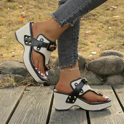 Fashionable women's platform slides, featuring plush cushioning & bold studded accents.