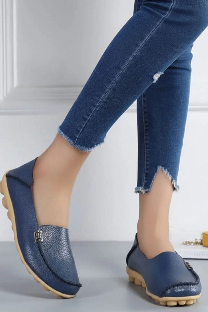 Comfortable women's flats, featuring a soft cushioned insole and classic round toe design.
