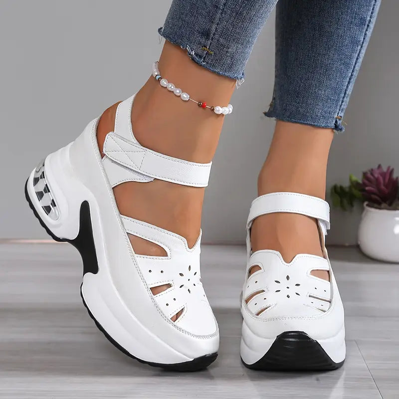 Comfortable women's walking sandals: cushioned wedge platform, breathable cutout, closed toe design.