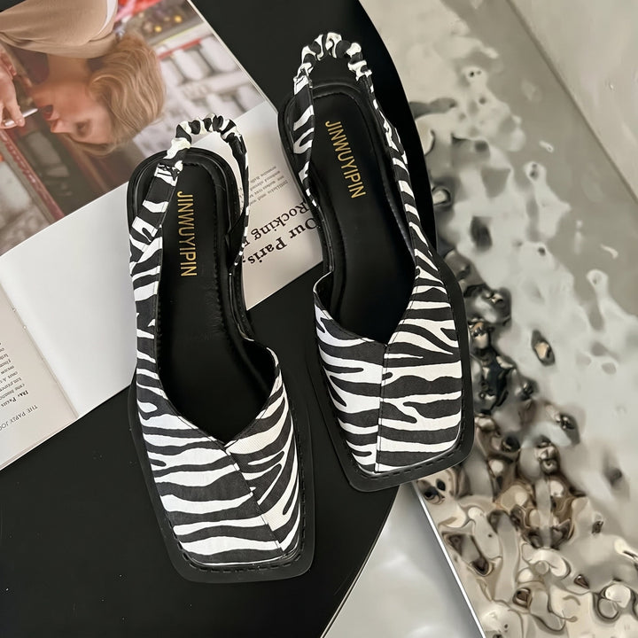 Elegant women's daisy print square toe slingback block heel sandals. Ideal spring fashion & summer footwear.