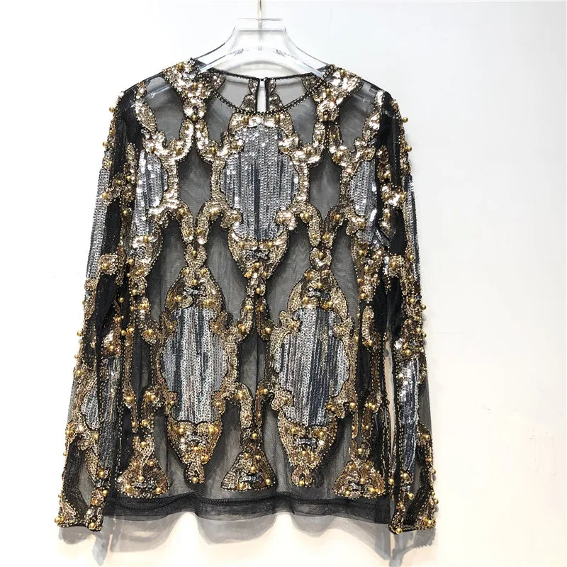 Glamorous women's sequin top with dazzling sparkle. A luxurious statement piece for any party or evening.