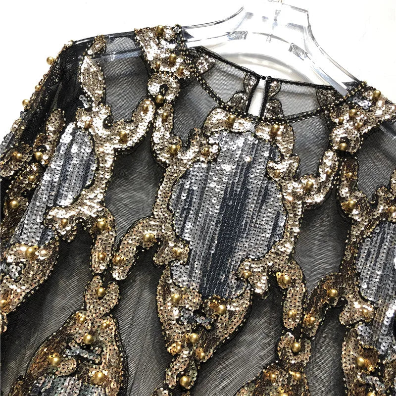 Chic black sequin women's top. Sparkling party wear, perfect for making a glamorous fashion statement.
