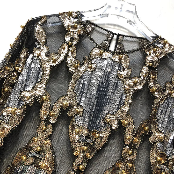Chic black sequin women's top. Sparkling party wear, perfect for making a glamorous fashion statement.