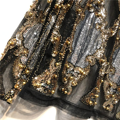 Luxurious gold sequin sparkle top for women. Elevate your evening wear with this dazzling fashion piece.