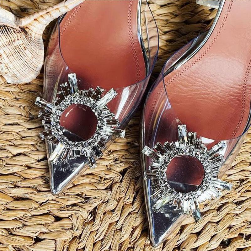 Stunning women's clear high heels featuring dazzling crystals. Transparent pumps for glamorous evening and cocktail parties.