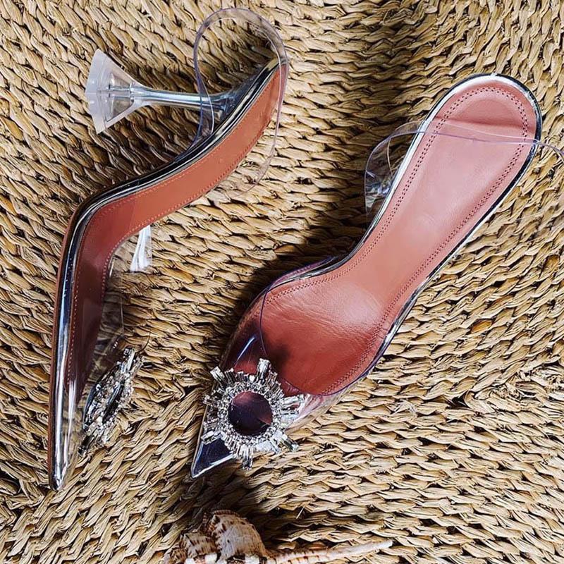 Fashionable women's crystal clear pumps. Elegant high heels, perfect transparent dress shoes for any special event.