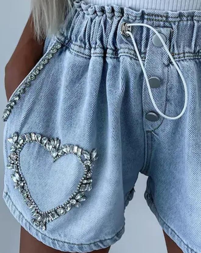 Stylish women's summer shorts with dazzling rhinestone heart embellishments. Perfect for casual glam fashion.