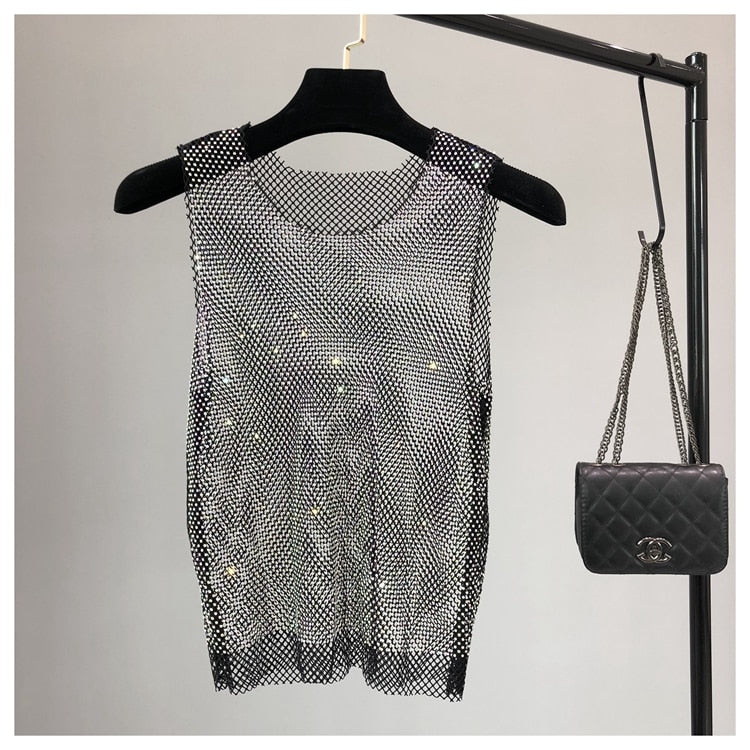 Sparkling women's sleeveless top, glamorous fashion for evening parties.
