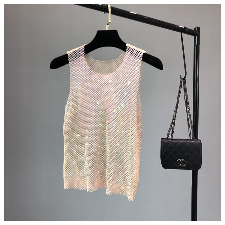 Glamorous women's evening top, sparkling with intricate rhinestone details.