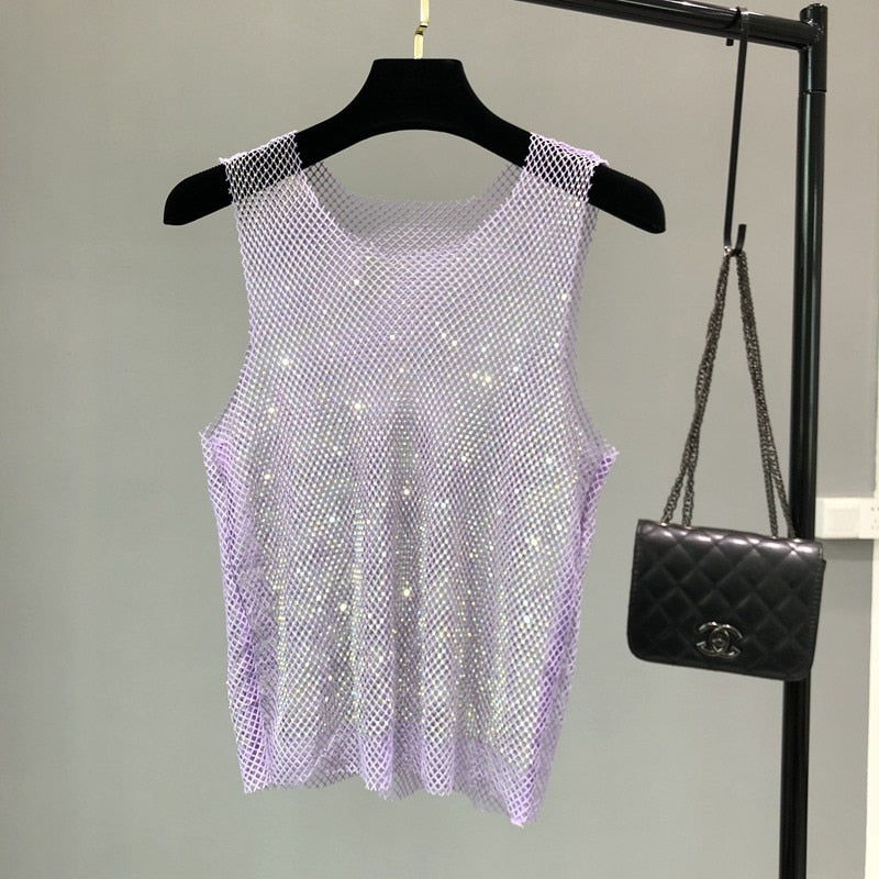 Women's glamorous rhinestone top, perfect sleeveless apparel for dazzling parties.