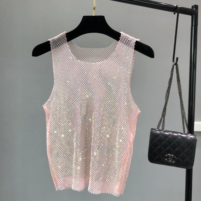 Stylish women's party wear tank top, sleeveless and adorned with dazzling rhinestones.
