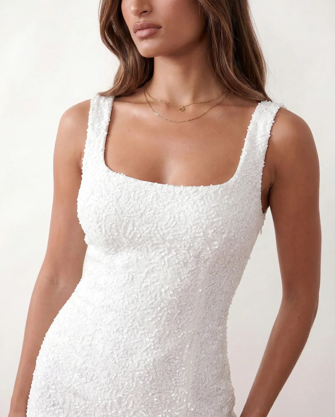 Sleeveless sequin homecoming dress for women, bodycon fit, with a charming side slit.