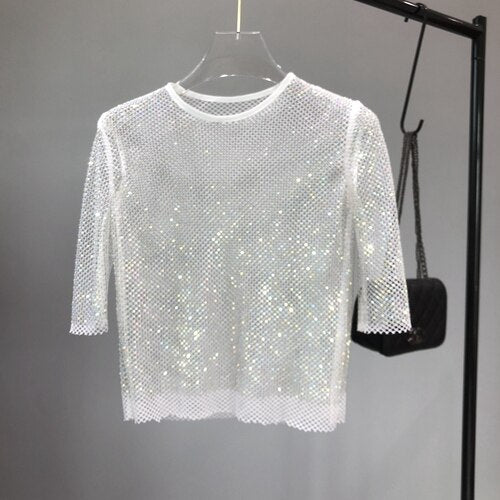 Glamorous sparkle shimmer top for women, a dazzling statement piece for any party.