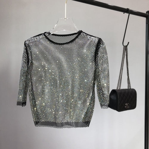 Stretch-fit women's one-size shimmer party top, dazzling & glamorous for evening wear.