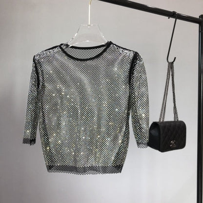 Stretch-fit women's one-size shimmer party top, dazzling & glamorous for evening wear.
