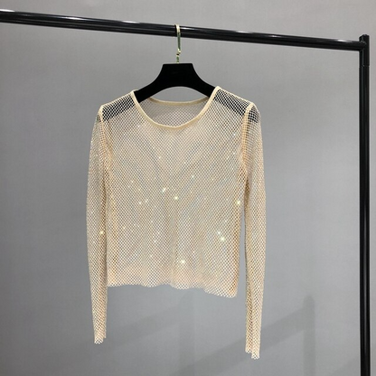 Dazzling women's shiny long sleeve top, ideal for a Vegas-themed party or glamorous evening outing. Rhinestone detail.