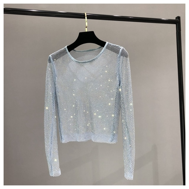Sparkling women's long sleeve top, shiny and dazzling with rhinestones. Essential party or evening wear for glamour.