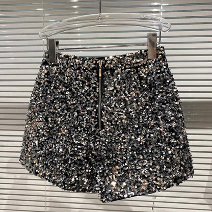 Trendy silver glitter high-waist women's shorts, offering a dazzling shine for parties & fashion. Bling apparel.