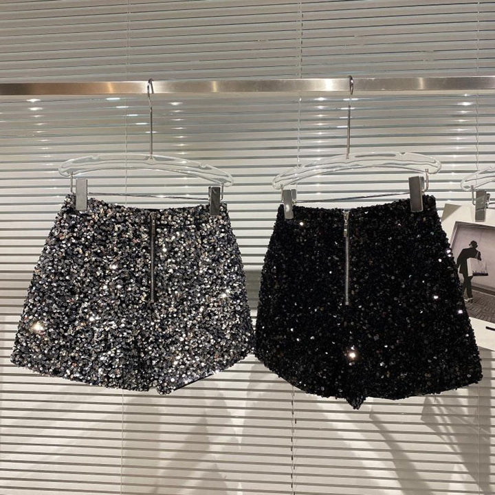 Fashionable women's party wear sparkle shorts. High-waist bling shorts in black, perfect for a dazzling look.