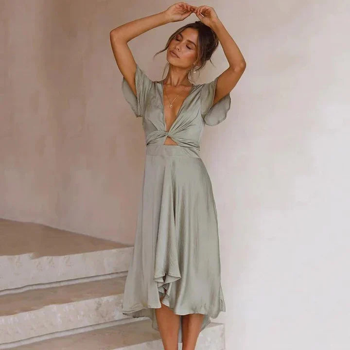Elegant women's deep V-neck midi dress with flutter sleeves & tie front, perfect wedding guest or cocktail party wear.