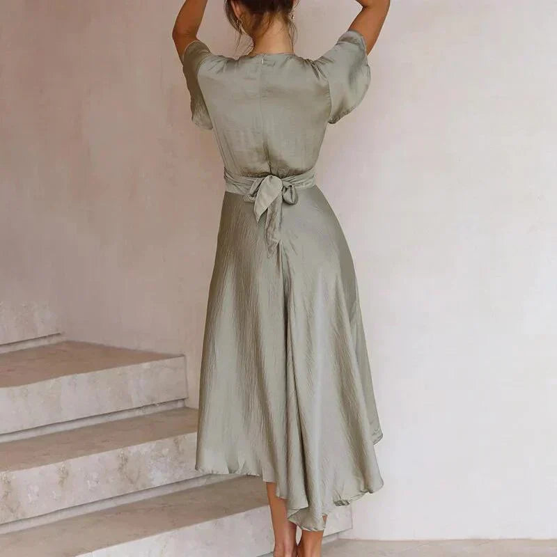 Beautiful women's deep V-neck midi dress with flutter sleeves & tie-front, perfect for elegant summer parties.