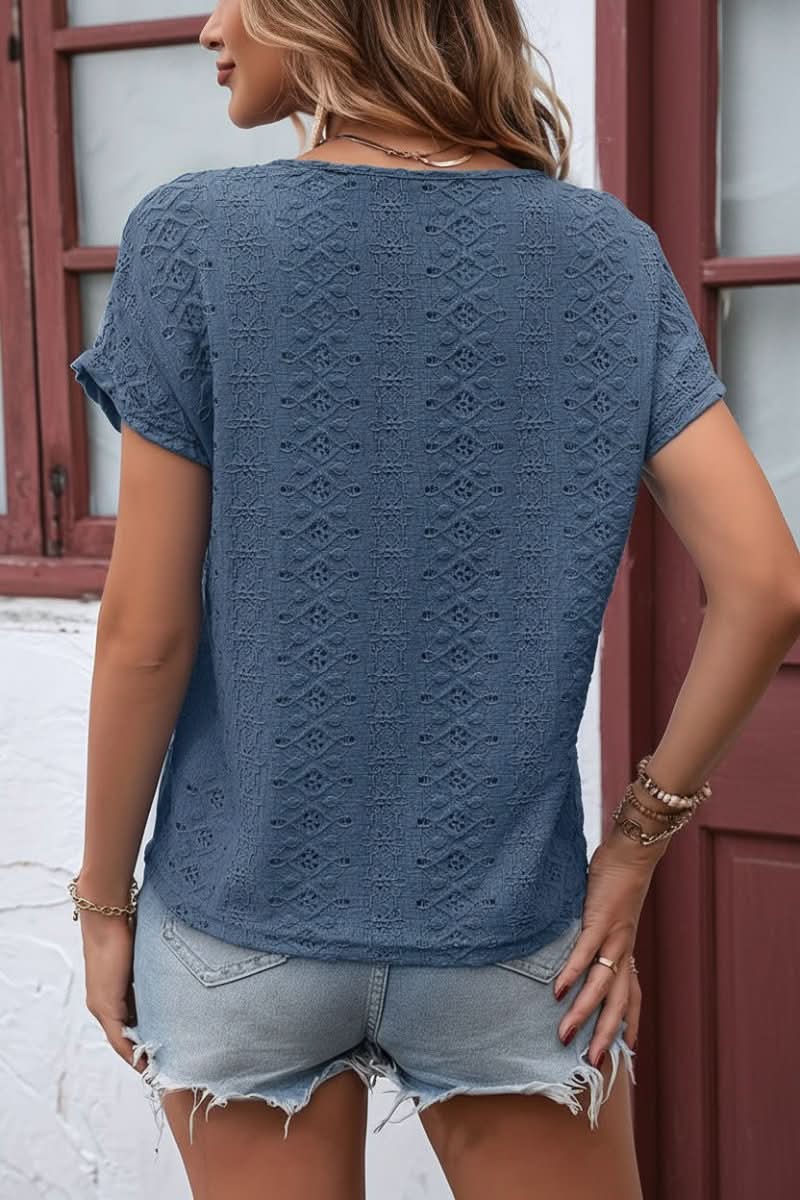 Comfortable short-sleeve women's top featuring elegant eyelet details and a modern notched neck.