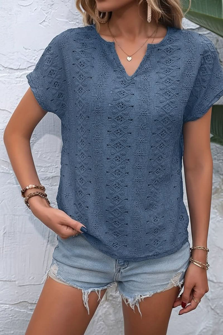 Stylish ladies' eyelet t-shirt with a notched neckline, ideal for versatile everyday casual wear.