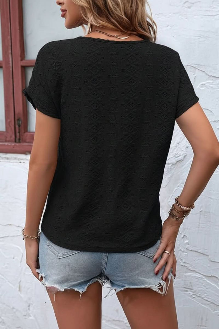 Versatile women's eyelet t-shirt, a comfortable summer fashion staple with a unique notched neck.