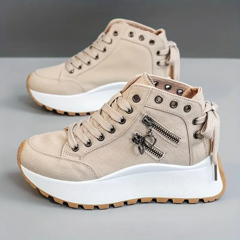 Casual women's high-top sneakers in denim blue, offering urban style & everyday comfort.