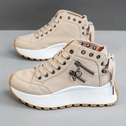 Casual women's high-top sneakers in denim blue, offering urban style & everyday comfort.