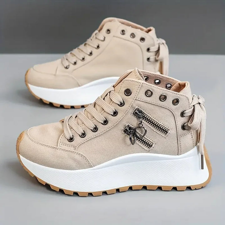 Casual women's high-top sneakers in denim blue, offering urban style & everyday comfort.