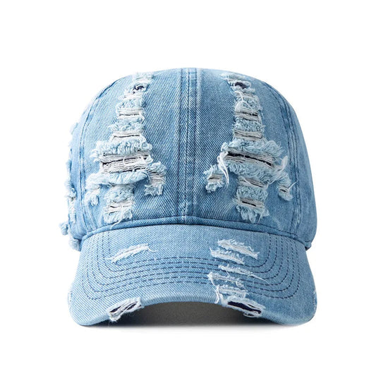 Women's distressed denim baseball cap for untamed street style. Casual, fashionable accessory.