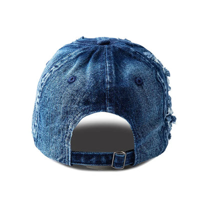 Front view of a women's distressed denim baseball cap with a curved brim, embodying untamed street fashion.
