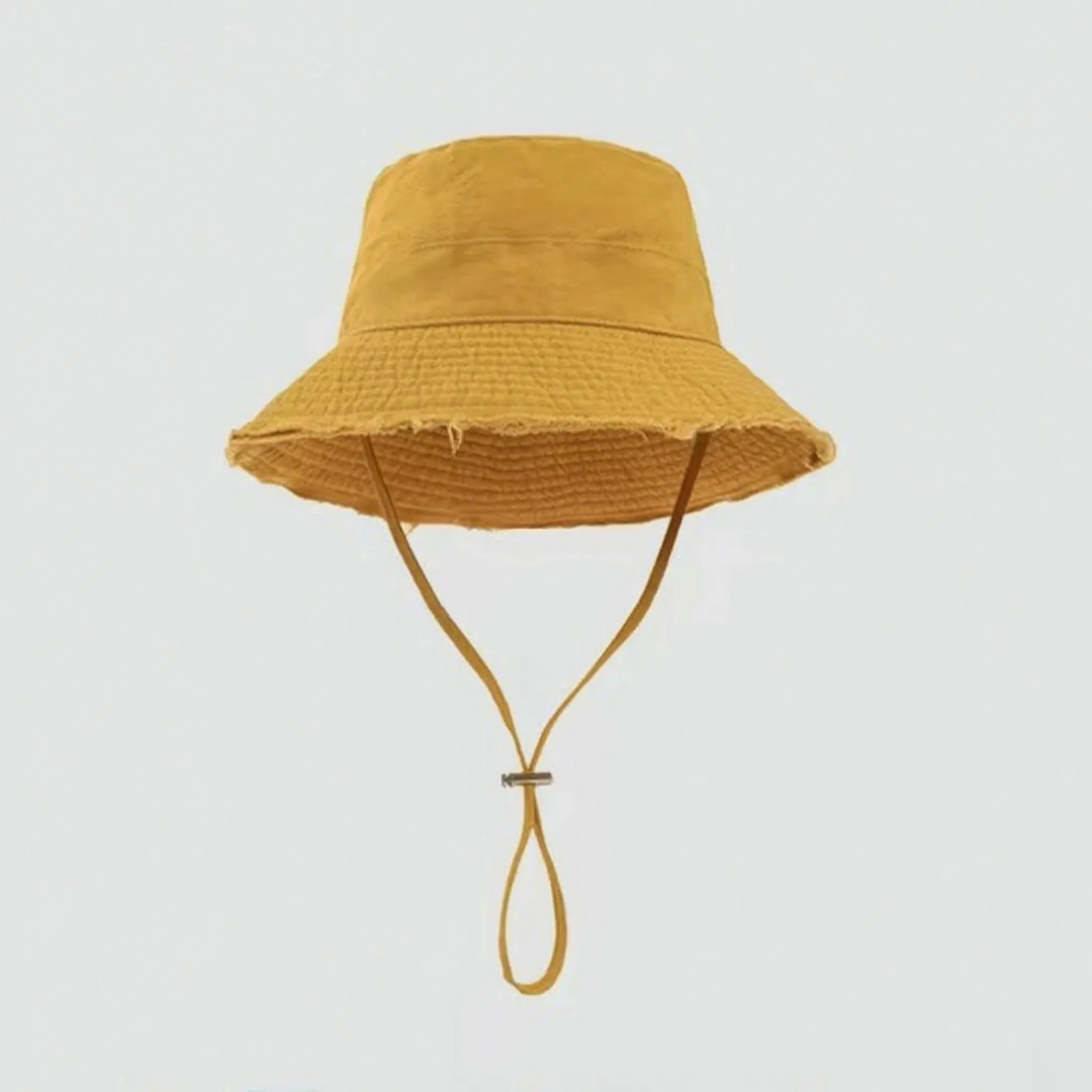 Women's distressed summer bucket hat, an essential travel accessory with an adjustable chin strap & sun shade.