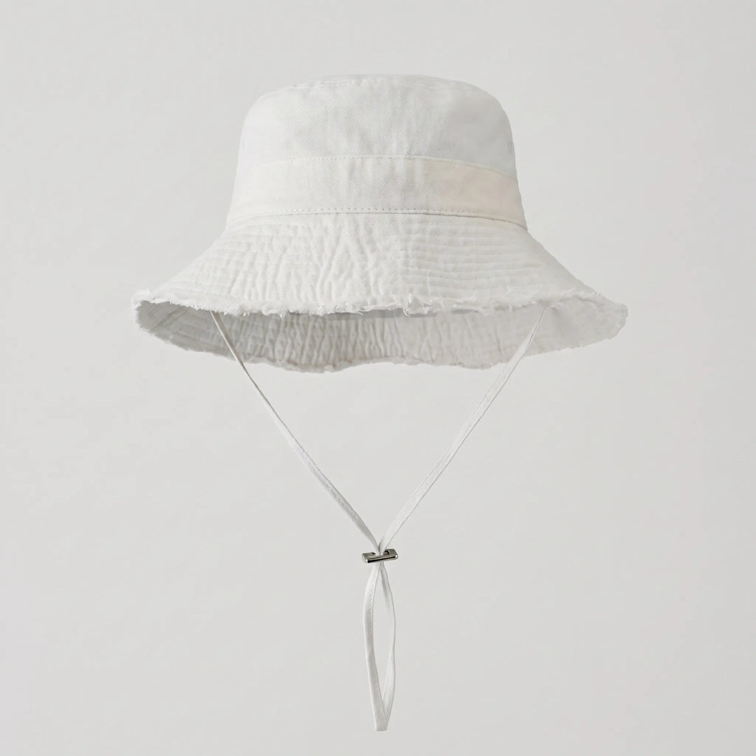Light blue distressed women's bucket hat with a practical chin strap, ideal for sunny days & outdoor fun.