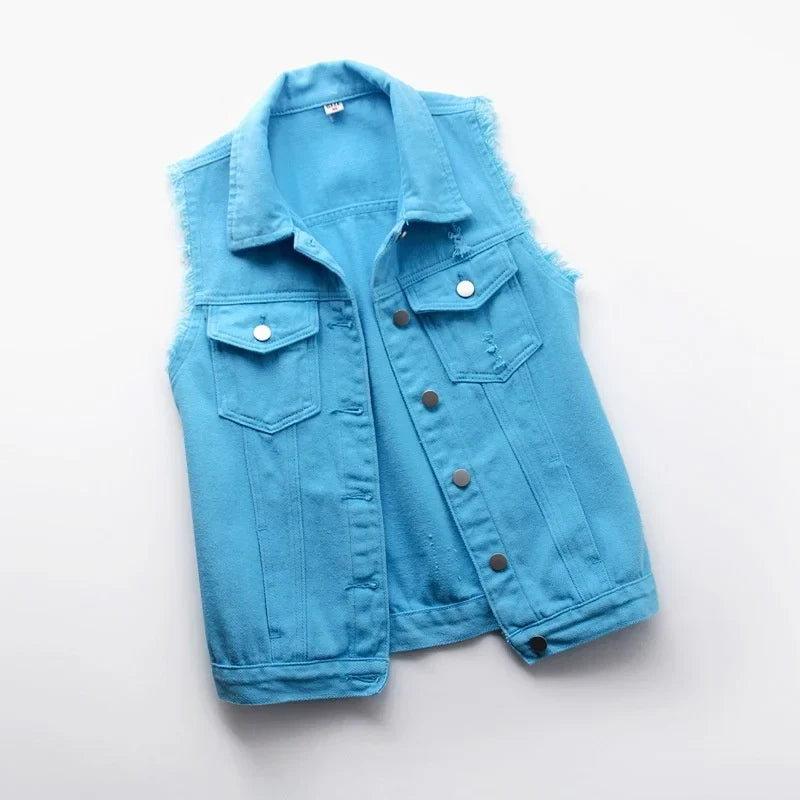 Edgy women's distressed oversized denim vest, a chic sleeveless jacket for streetwear style.