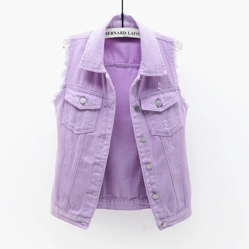 Women's oversized distressed denim vest, a versatile sleeveless jacket for trendy outfits.