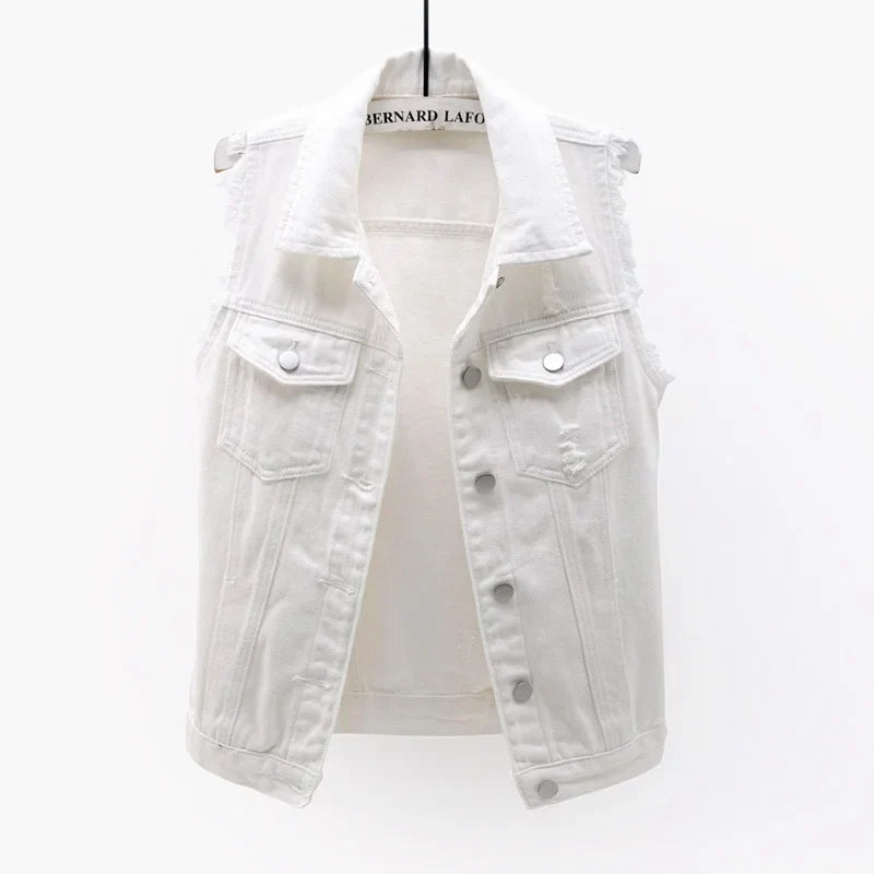 Women's oversized distressed denim sleeveless jacket, a cool layering piece for streetwear.