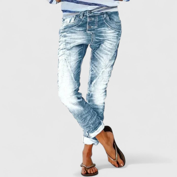 Relaxed fit women's distressed jeans, wide leg, comfortable denim pants for a trendy casual look.