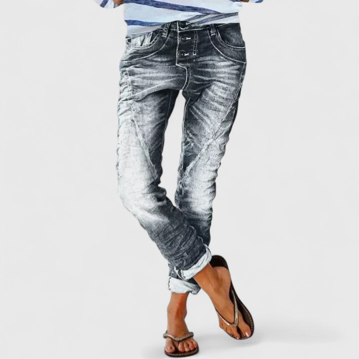 Effortless style with women's distressed wide-leg jeans, mid-rise, relaxed fit, and cuffed hem.