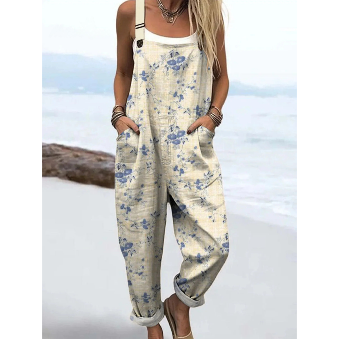 Women's ditsy floral print jumpsuit with adjustable straps & pockets, ideal for casual summer boho vacation style.